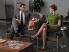 Don Draper (Jon Hamm) and Joan Holloway (Christina Hendricks) speculate on the future of their newly disabled colleague in "Guy Walks Into an Advertising Agency"--copyright AMC 2009