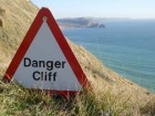 We can read the signs, but can we stop from falling off the edge? Photo by Panoramio user jk1812.