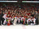 Canada's women's Olympic hockey team pose with their gold medals after the winning game.
