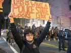 A protester holds a sign near the Brooklyn Bridge, November 17, 2011.