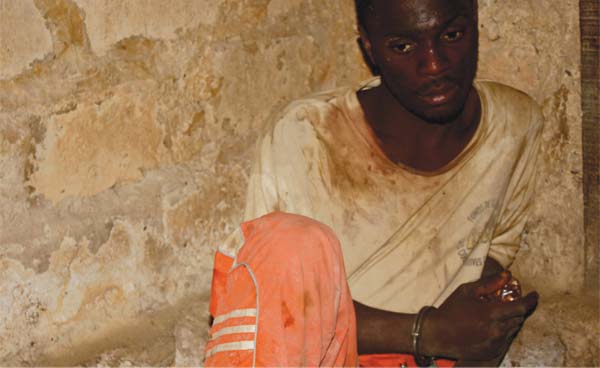 Prisoner in Butuo, Liberia. Photo credit: Myles Estey