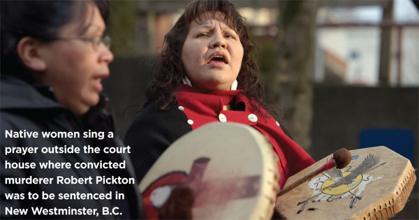 Native women sing a prayer outside the court house where convicted murderer Robert Pickton was to be sentenced in New Westminster, B.C., December 11, 2007