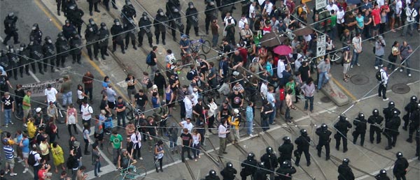 Crowd hemmed in at Queen and Spadina. Photo by Jonas Naimark.