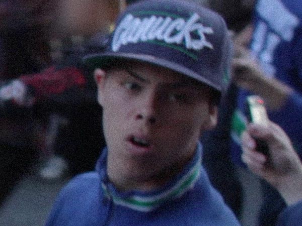 A suspect wanted for questioning by Vancouver police following the June 2011 riot that erupted after the Vancouver Canucks lost the Stanley Cup playoffs. The law is still grappling with how to track crime in the age of social media and ubiquitous cell phone cameras. Image courtesy Vancouver Police.