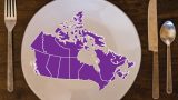 Image of a purple map of Canada on top of a dinner plate with cutlery on either side.