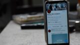 Closeup photo of a smartphone displaying Netflix's Twitter account with a Bridgerton banner.